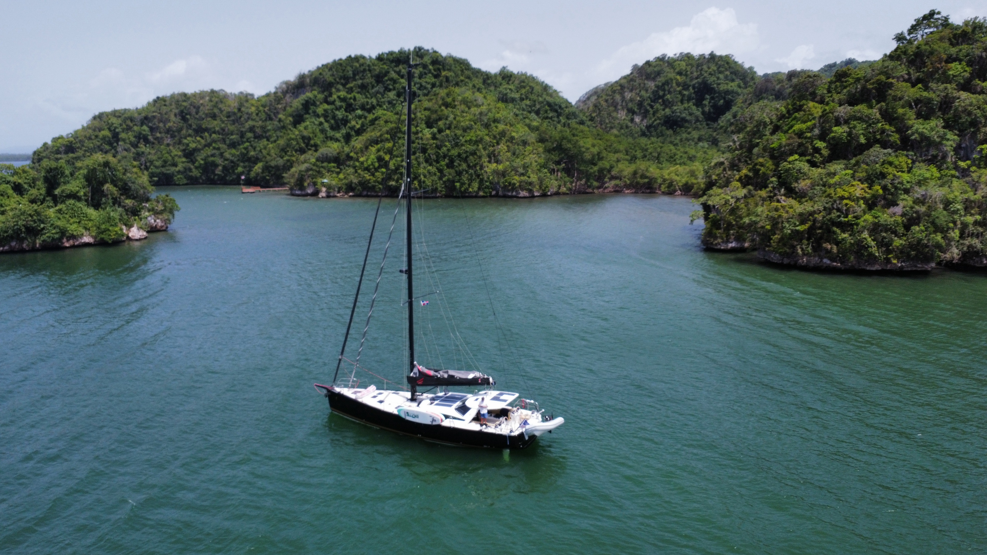 Velvet Elvis at anchor among rolling green hills